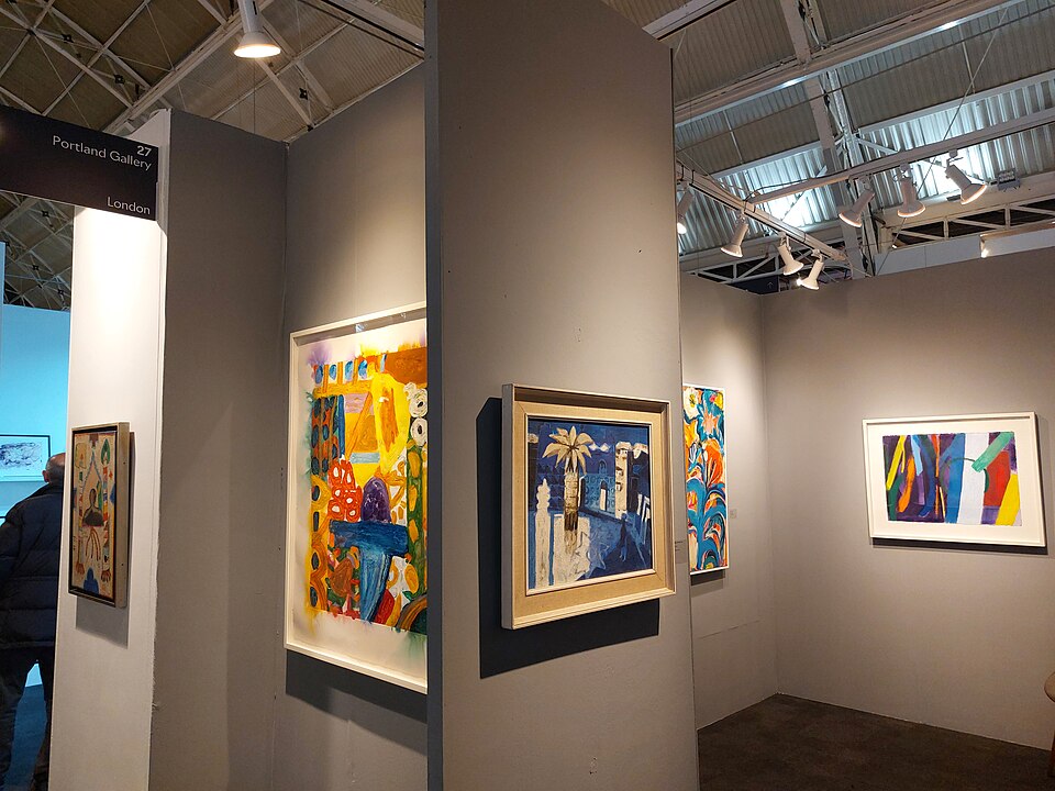Paintings displayed in the Portland Gallery stand at the London Art Fair.