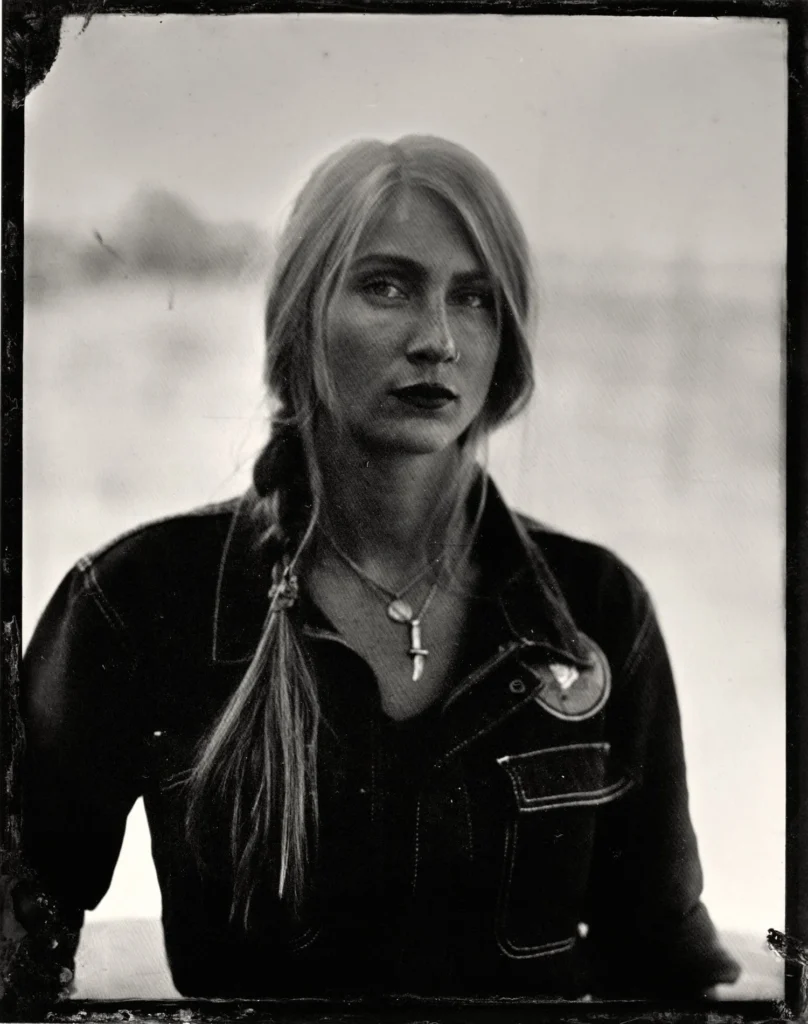 Black-and-white tintype portrait of artist Paige Whitcomb